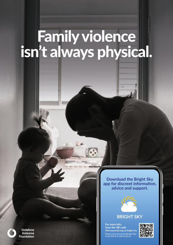 Image of a poster to be used in promoting the Bright Sky app. Image is of a woman seated head in hands, in a hallway in front of a small child playing. Text says: Family violence isn't always physical.