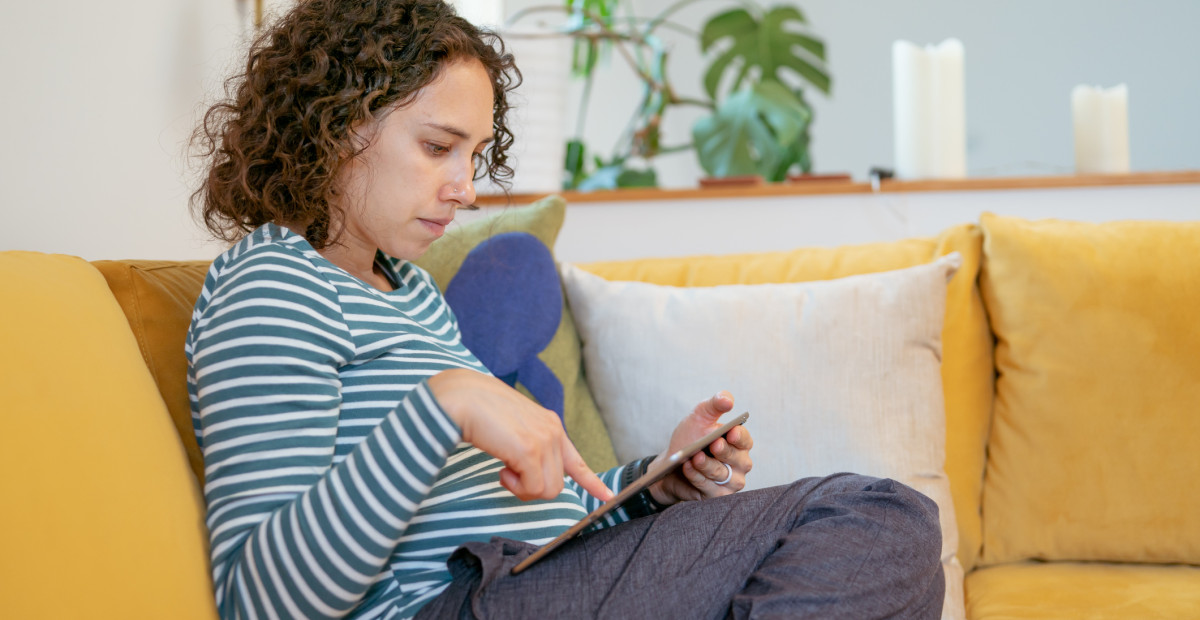 UNDERSTAND caucasian woman searching iPad iStock 1408973453